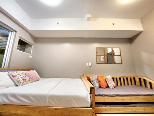 Postel nebo postele na pokoji v ubytování Baguio-Cozy & affordable staycation