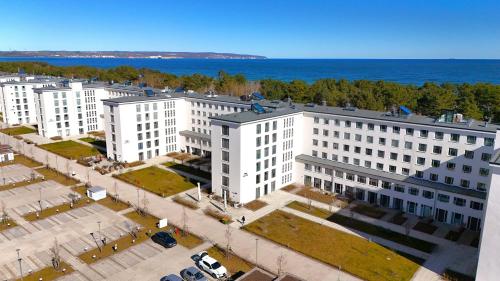 an overhead view of white buildings in front of the ocean at Haus Arkona - Apartment Seestern - 5 2 in Prora