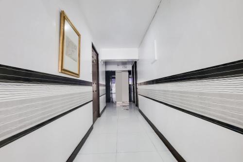 a hallway with empty lanes in a building at OYO 894 Cosmo Hotel P Campa Manila in Manila