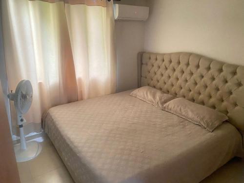 Ένα ή περισσότερα κρεβάτια σε δωμάτιο στο Apartamento en Villa Carolina