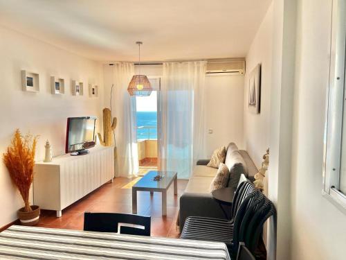 Televízia a/alebo spoločenská miestnosť v ubytovaní Las vistas Piso