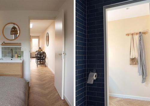 a bedroom with a blue tiled wall next to a bathroom at Beachhouse Wijk aan Zee! in Wijk aan Zee