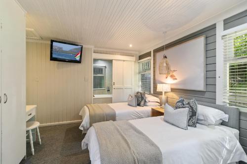 Кровать или кровати в номере Knysna - Sunseeker Chalet