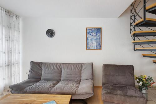 a living room with a couch and a table at Obstbau Koch in Bodman-Ludwigshafen