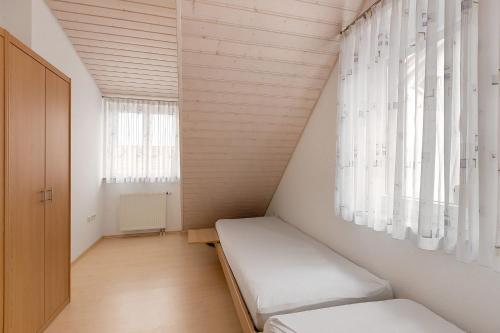 a small room with a bed and a window at Obstbau Koch in Bodman-Ludwigshafen