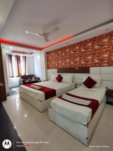 Ένα ή περισσότερα κρεβάτια σε δωμάτιο στο Hotel The White Sand Suites
