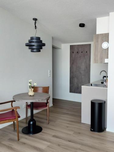 a kitchen and dining room with a table and chairs at Blom studio's in Hillegom