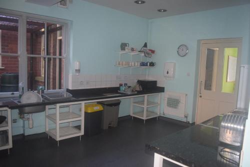 a kitchen with a sink and a counter top at Kington Accommodation in Kington