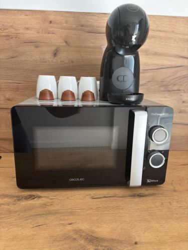 a coffee maker sitting on top of a table at Apartamento VM junto al Parque Tecnológico de Andalucía in Campanillas