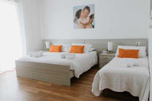 Ένα ή περισσότερα κρεβάτια σε δωμάτιο στο BnB Nuova Vita