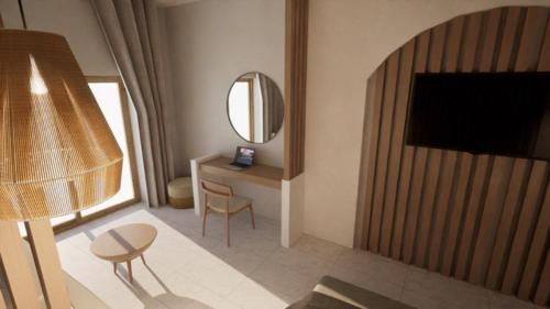 a living room with a table and a mirror at Kostas Studios in Faliraki