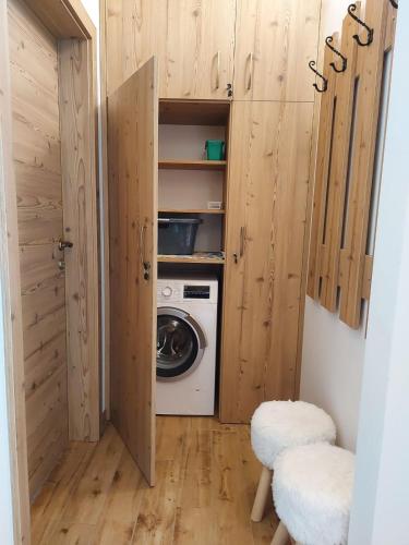 a laundry room with a washer and dryer at A house with the view in Srednja Vas v Bohinju