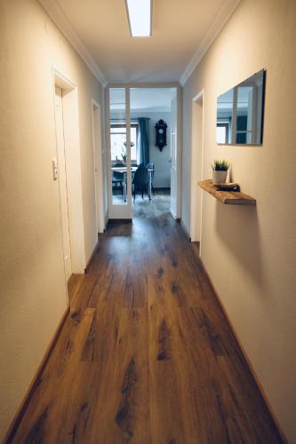 an empty hallway with a hard wood floor in a house at Ferienwohnung Sepp in Inzell