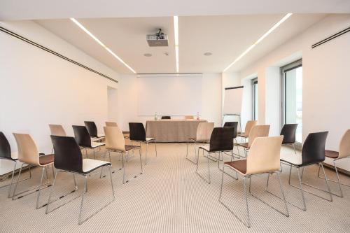 a conference room with chairs and a table in it at Aiden by Best Western JHD Dunant Hotel in Castiglione delle Stiviere