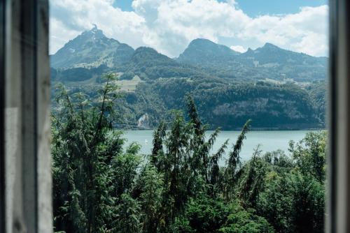a view of a lake with mountains in the background at Landgasthof Paradiesli in Weesen