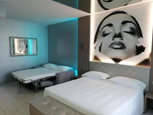 Posteľ alebo postele v izbe v ubytovaní Hotel Camelia