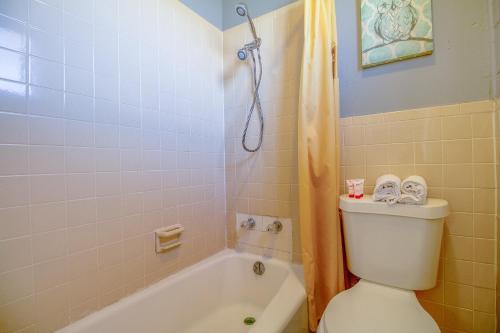 a bathroom with a tub and a toilet and a shower at Wheeler Inn Texas, US - 83 By OYO in Wheeler