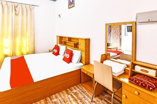 Postel nebo postele na pokoji v ubytování OYO 138 Gulf Sand Motel