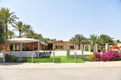 Zahrada ubytování OYO 138 Gulf Sand Motel