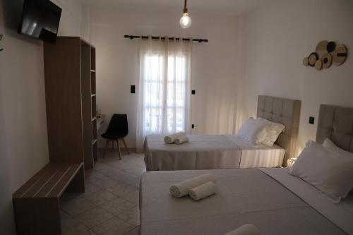 Ένα ή περισσότερα κρεβάτια σε δωμάτιο στο Pension St.George Rooms & Studios