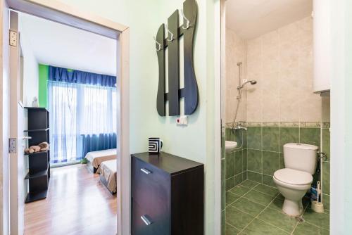 a bathroom with a toilet and a shower at Sea&Park Apartment by Linas BNB in Varna City