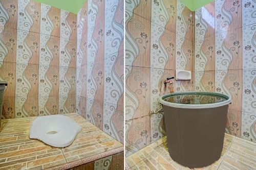a bathroom with a toilet and a trash can at SPOT ON 91716 Kost Yy Syariah in Mojokerto