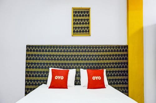 Кровать или кровати в номере OYO 91796 Guest House Ghalta Syariah