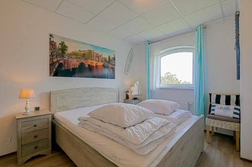 Ένα ή περισσότερα κρεβάτια σε δωμάτιο στο Appartement Dünenblick - Residence Juliana Julianadorp aan Zee