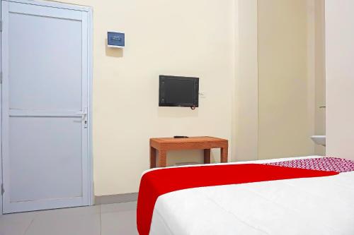 TV a/nebo společenská místnost v ubytování Super OYO Capital O 91790 S1 Residence