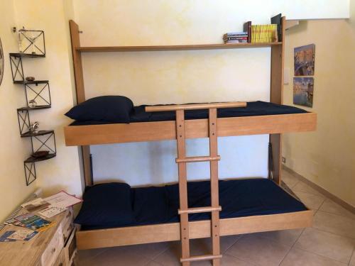 a couple of bunk beds in a room at Casa Margot in Sanremo