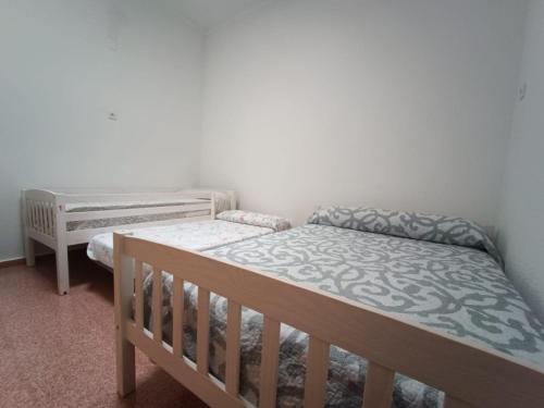 Ένα ή περισσότερα κρεβάτια σε δωμάτιο στο Hostel Rural David Broncano