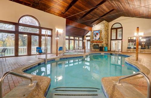 a swimming pool in a house with a large building at Nordic Village Condominium Resort in Jackson