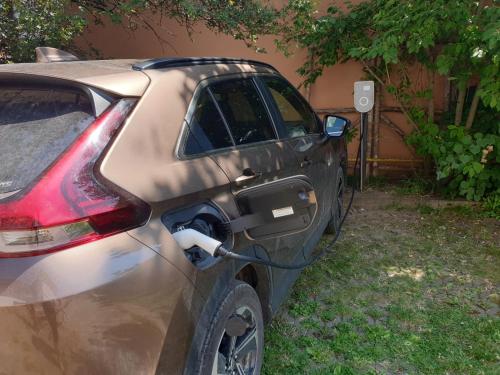 a car is plugged into an electric car charger at StudioRasnov in Râşnov