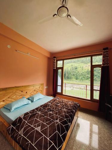 Postel nebo postele na pokoji v ubytování Hotel Manik