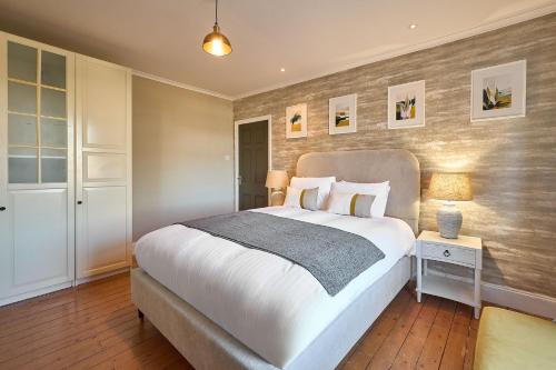 a bedroom with a large bed in a room at Host & Stay - Louvaine House in Witton Gilbert