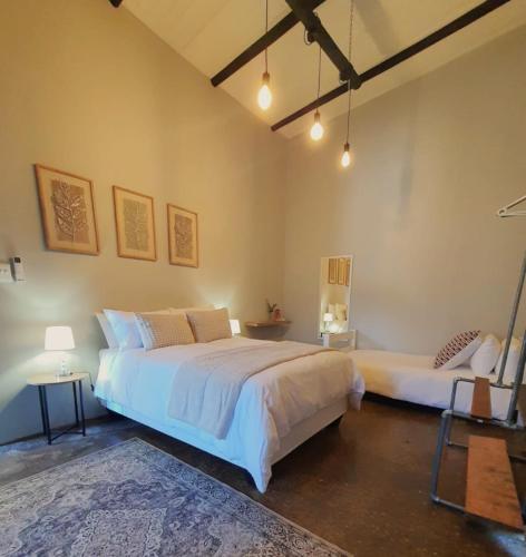 a bedroom with a large bed in a room at Helpmekaar in Wellington