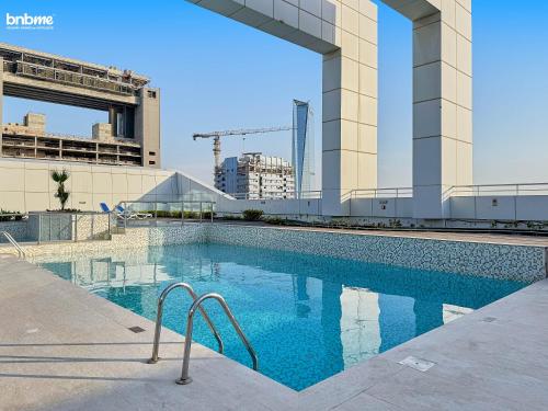 a swimming pool on the side of a building at bnbmehomes - Gold crest views 2 in Dubai