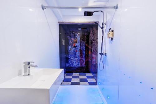 a bathroom with a sink and a shower at Briggate Hotel in Leeds