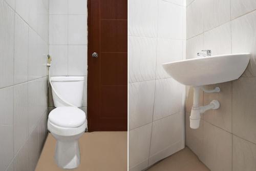 Ванная комната в Hotel O 76 Gayungsari