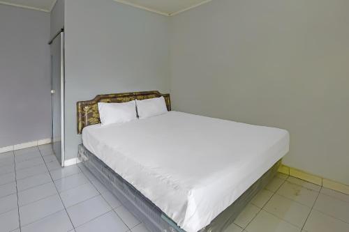Ένα ή περισσότερα κρεβάτια σε δωμάτιο στο Hotel O Cipto Arum