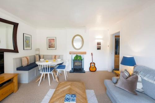 a living room with a couch and a table at The Mews Flat, near Clifton Suspension Bridge with off-street parking in Bristol