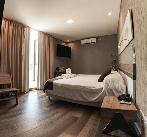 Postel nebo postele na pokoji v ubytování Hotel Belén