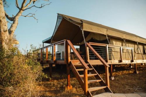 a house with a staircase leading up to it at Longhill Reserve in Addo