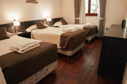 Postel nebo postele na pokoji v ubytování Hotel Belén