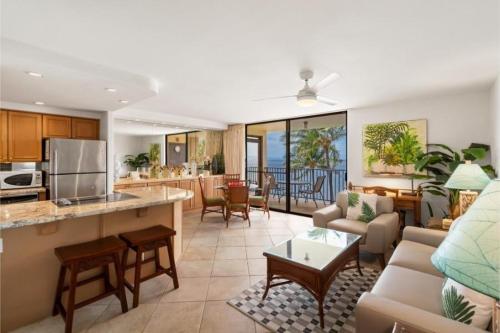 a living room with a kitchen and a living room at Kihei Beach, #603^ condo in Kihei