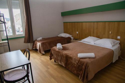 Postel nebo postele na pokoji v ubytování Hotel Durand Le Patio