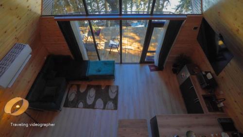 an overhead view of a living room with wood floors at Small Forest in Batumi