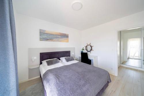 Postel nebo postele na pokoji v ubytování APARTAMENT PRZY WYDMIE