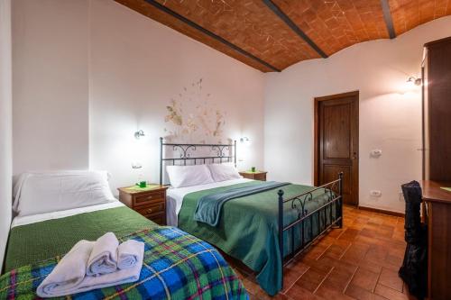 Postel nebo postele na pokoji v ubytování Agriturismo Meriggio