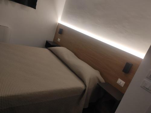Letto o letti in una camera di Residenza Porta Romana